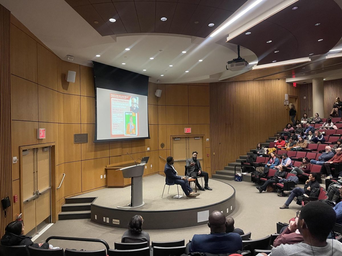 Rufus Burnett Jr. , associate professor of systematic theology, moderates Christopher W. Hunt’s talk at Fordham.