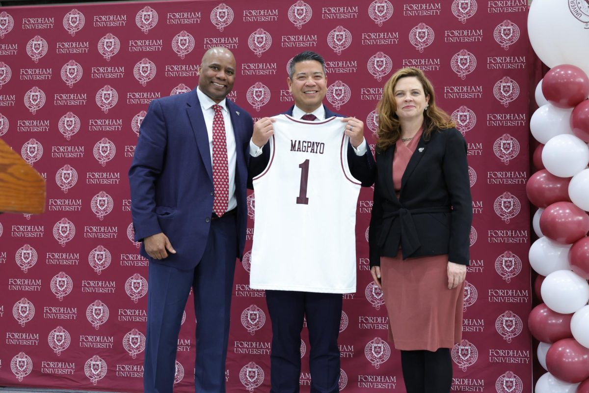  Mike Magpayo with Fordham Athletic Director Charles Guthrie and University President Tania Tetlow.