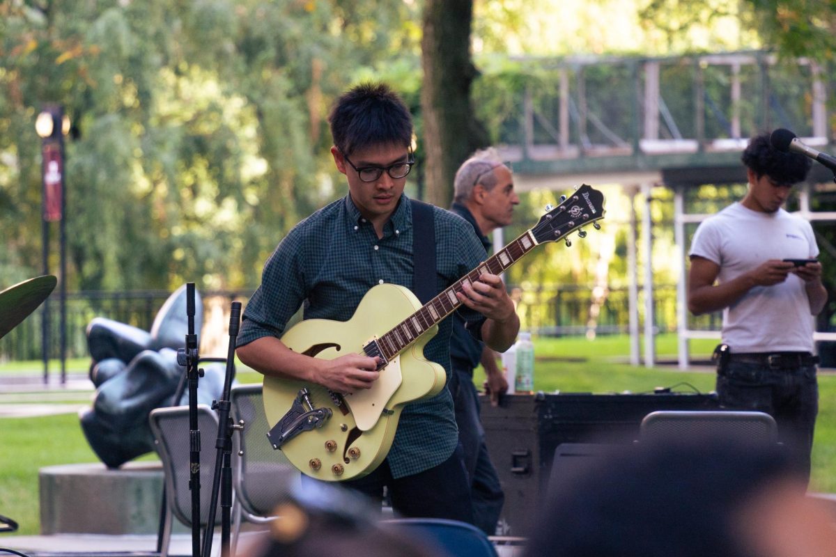 Fordham senior and jazz guitarist Maco Dacanay hopes to see Spotify implement AI transparency features. 
