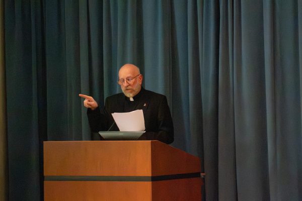 Thomas Massaro, Jesuit priest and professor of moral theology, delivered a lecture on the ethics of meritocracy.