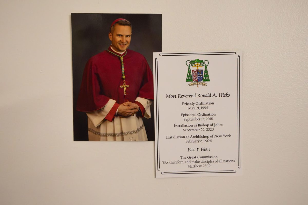 Archbishop Hicks’ Coat of Arms includes symbols that represent his ministerial experience in Chicago and El Salvador.