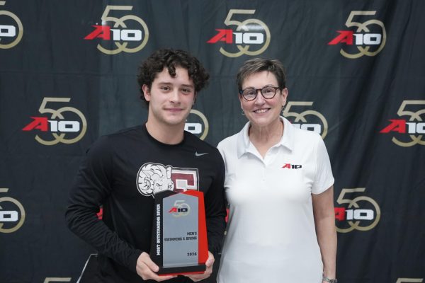David Vargas on the podium as the Atlantic 10 champion after coming in first in the one-meter dive.