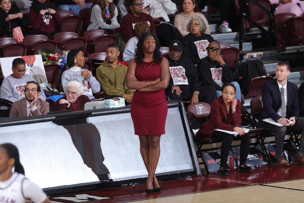 Bridgette Mitchell on the sideline coaching one of the women’s basketball games in the Rose Hill Gymnasium.