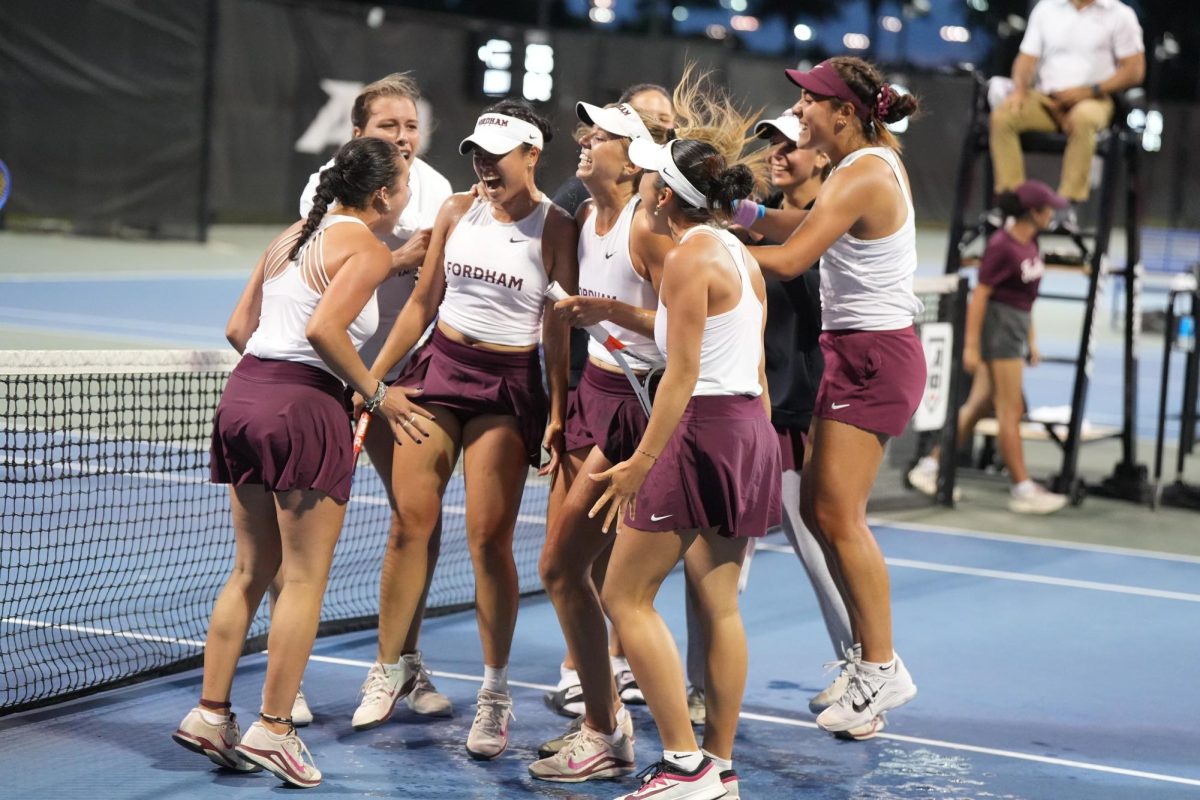 The Fordham women’s tennis team celebrating after they won their match against Davidson College sending them to the A10 Championship.