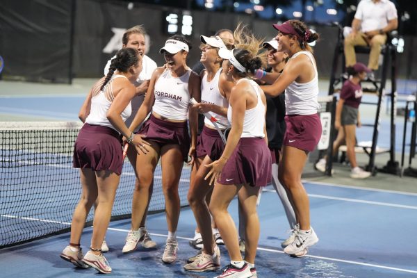 The Fordham women’s tennis team celebrating after they won their match against Davidson College sending them to the A10 Championship.